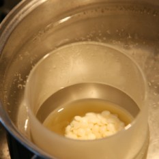 Pine-Scented Beeswax Candle | thecrunchyurbanite.com — Make your own all-natural beeswax candles with essential oils!